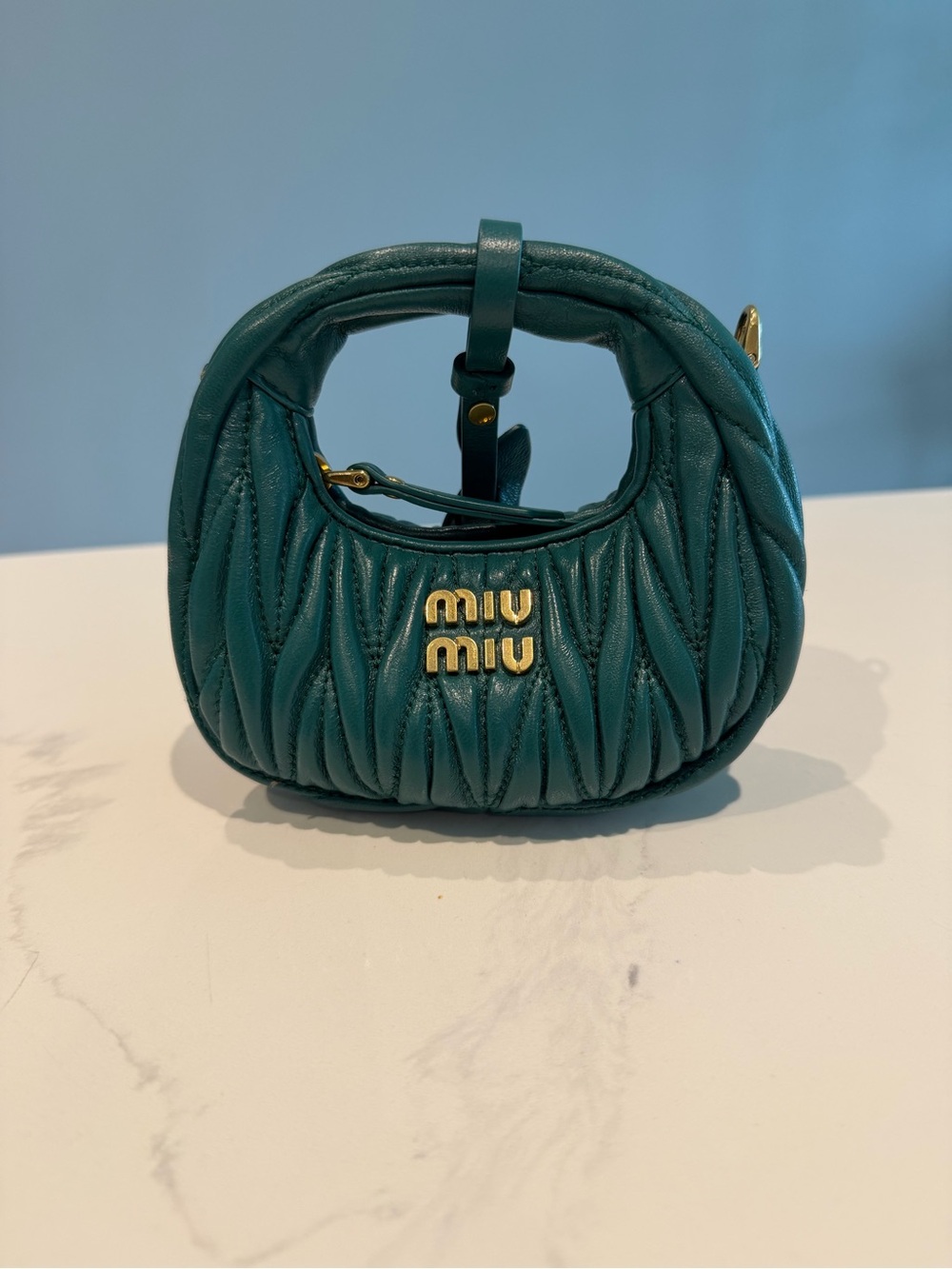 Miu Miu Metallic Nappa Matelasse Micro Wander Hobo in Laguna